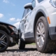 Car accident involving a white SUV and a black sedan