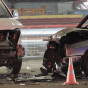 Two cars sit ideal after a car accident. Blog entry details things to consider when hiring an auto injury attorney.
