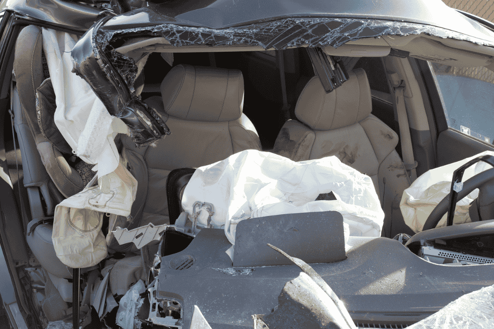 Air bags have deployed and a car is a tangled mess after a severe auto accident. Blog topic centers on hiring an auto injury attorney.